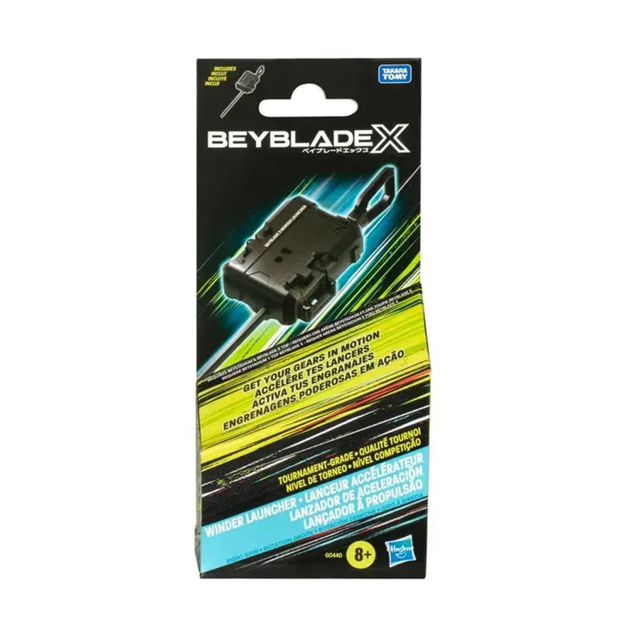 Beyblade X Winder Launcher retail packaging on a white background, showing the black launcher and colorful product graphics.