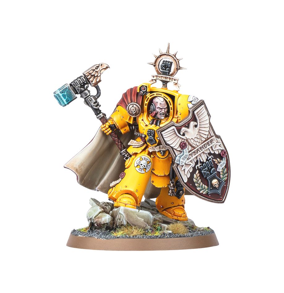 Warhammer figurine in yellow armor with a large axe and shield on a white background