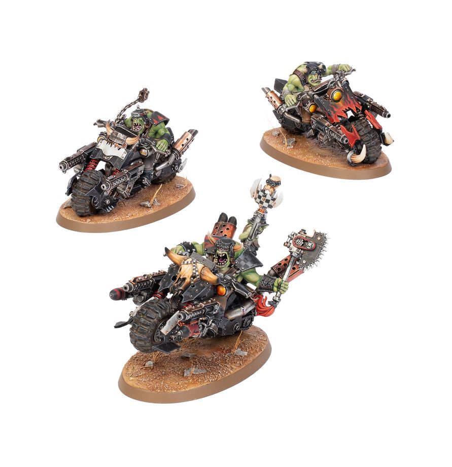 Three painted fantasy motorcycle miniatures on round brown bases, shown against a plain white background. The figures include green-skinned creatures and a dog-like rider with weapons and a skull-shaped handlebar.