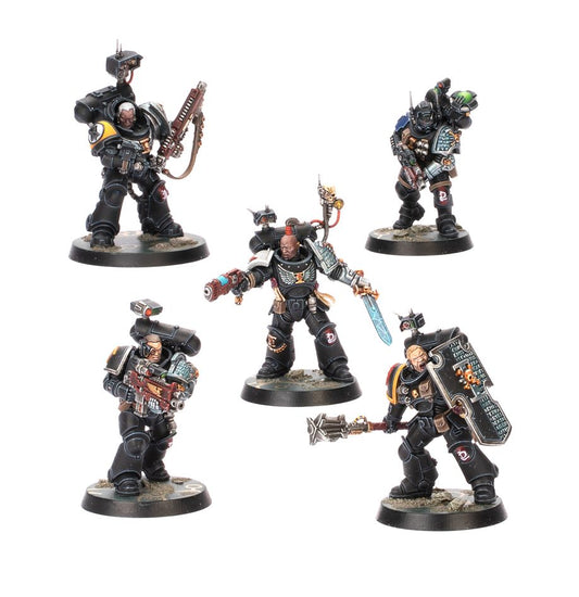 Five miniature figures from a warhammer-themed game on a white background