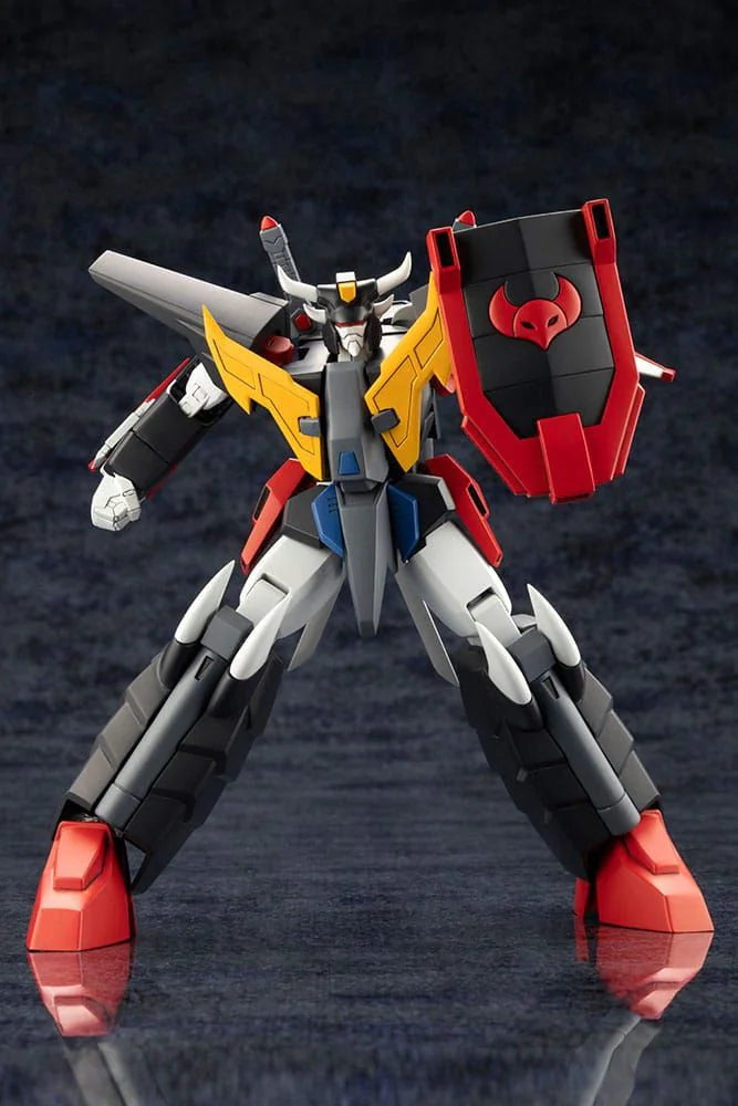 Toy robot figure with red, yellow, and black colors on a dark reflective surface
