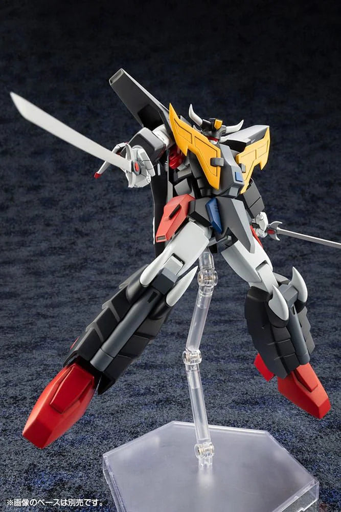 Model kit of a robot with red, black, and yellow colors on a dark background